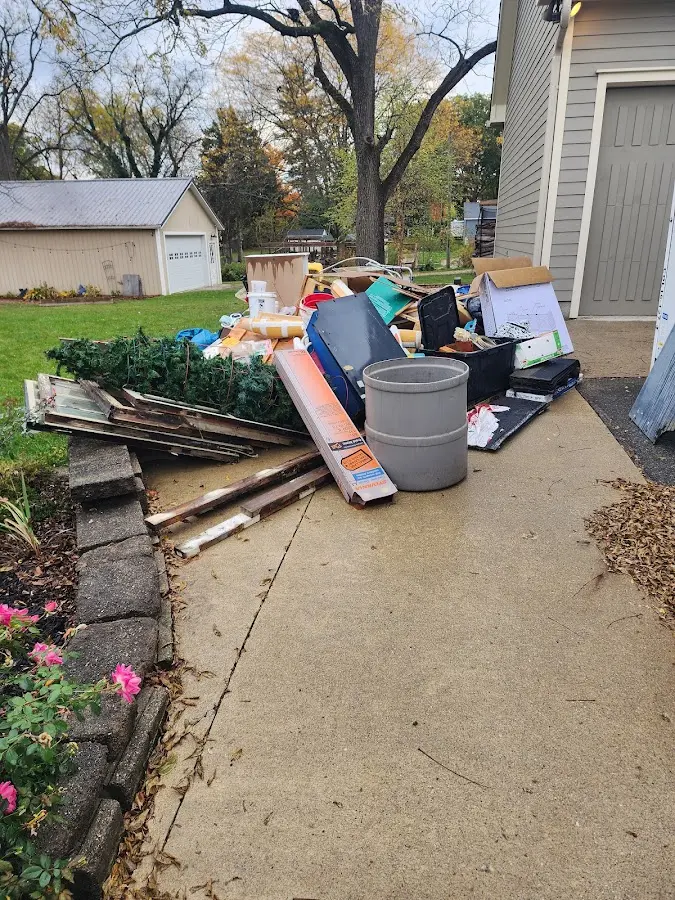 Dumpster being loaded with debris for Estate Cleanout Dumpster Rental in South Cleveland